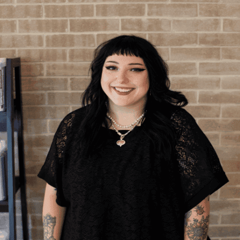 Portrait of Adrianna, a professional stylist at Salon JaDor, showcasing their expertise and style.
