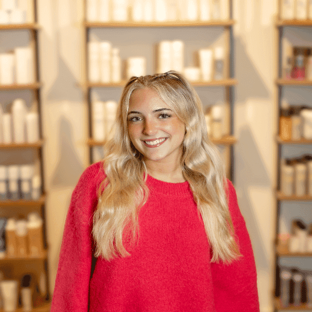 Portrait of Kayden, a professional stylist at Salon JaDor, showcasing their expertise and style.