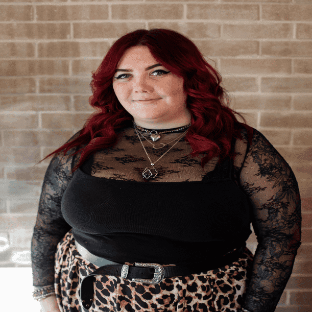 Portrait of Kayla, a professional stylist at Salon JaDor, showcasing their expertise and style.