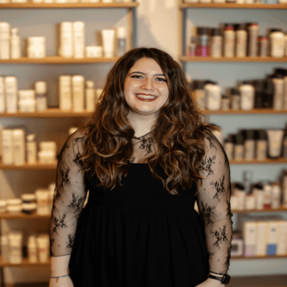 Portrait of Alyssa, a professional stylist at Salon JaDor, showcasing their expertise and style.