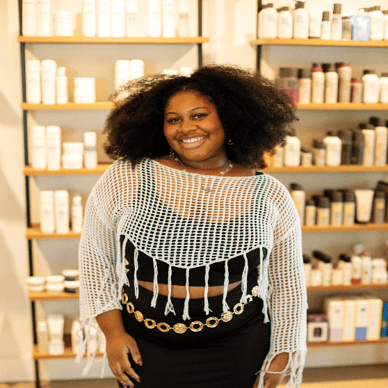 Portrait of Jaylene, a professional stylist at Salon JaDor, showcasing their expertise and style.